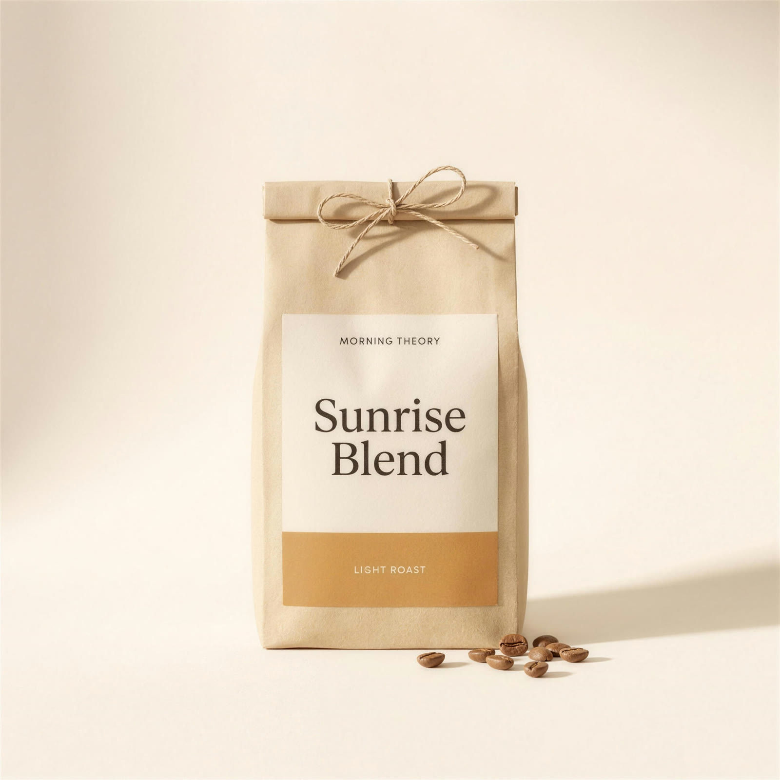 Sunrise Blend kraft bag with a caramel light roast label, whole beans scattered at its base